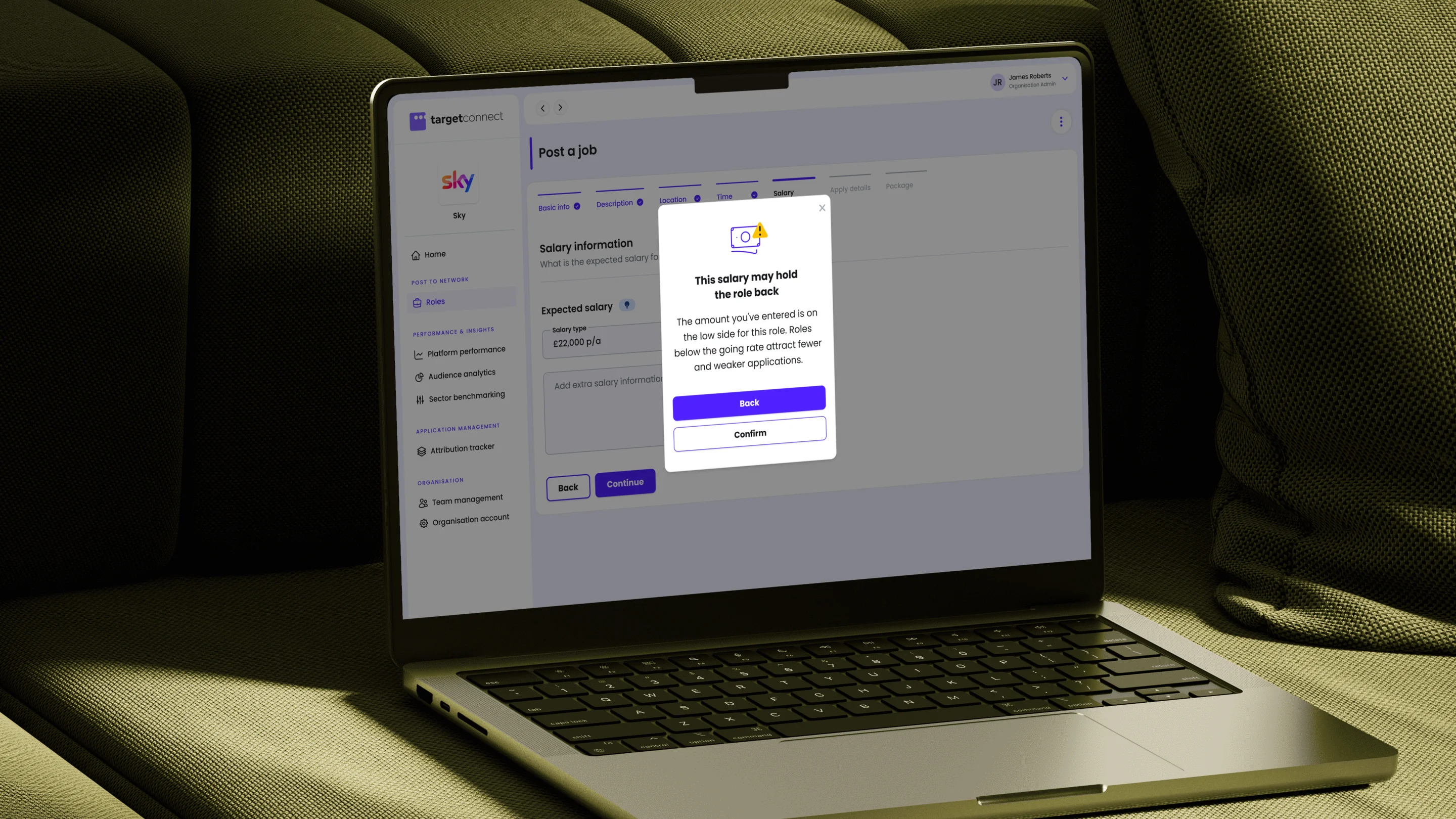 The salary step of the post a role flow, with a modal warning that the entered salary is below the going rate and may attract fewer applications