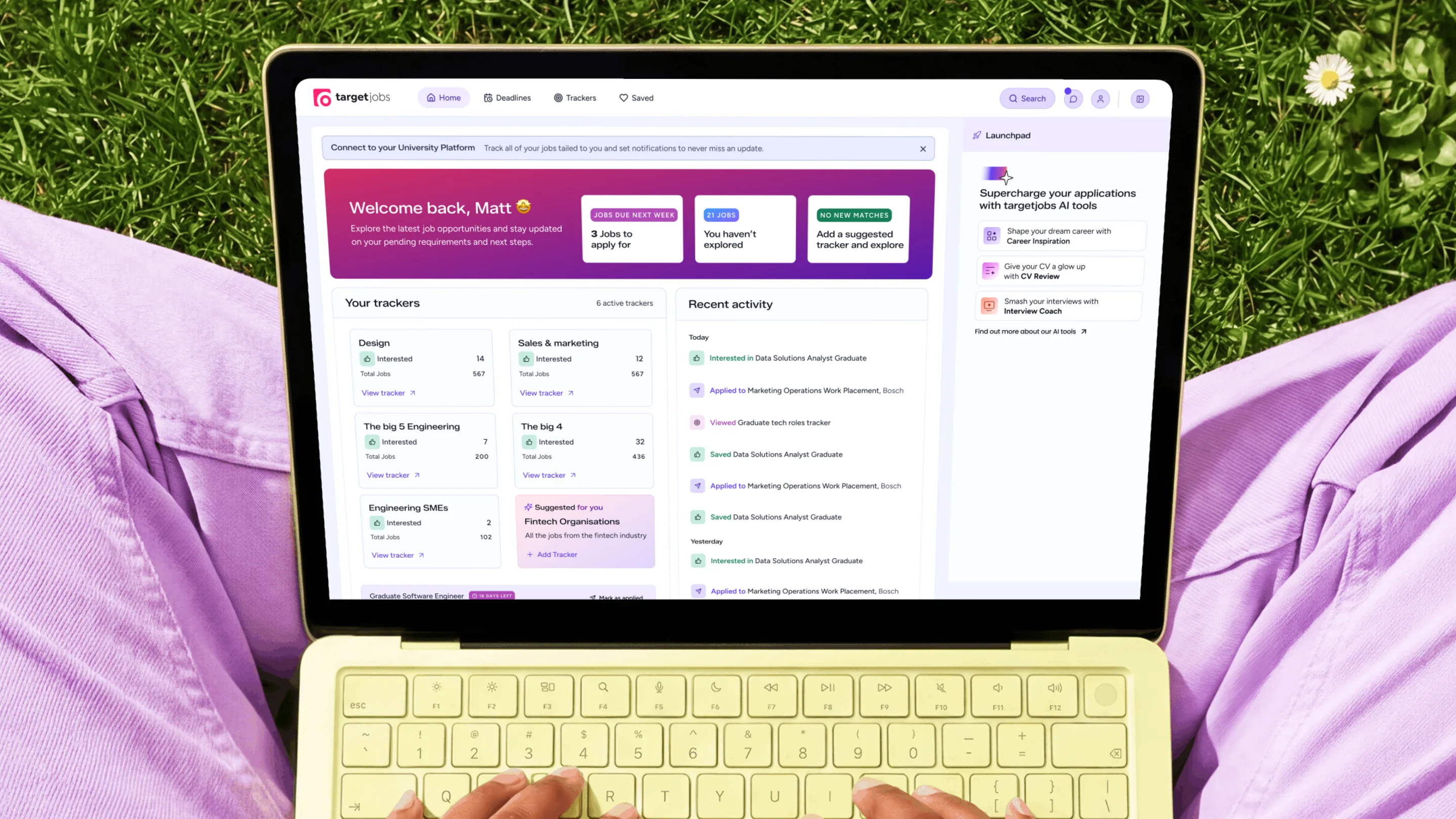 The student dashboard on a laptop showing job trackers, a recent activity feed and an AI tools launchpad